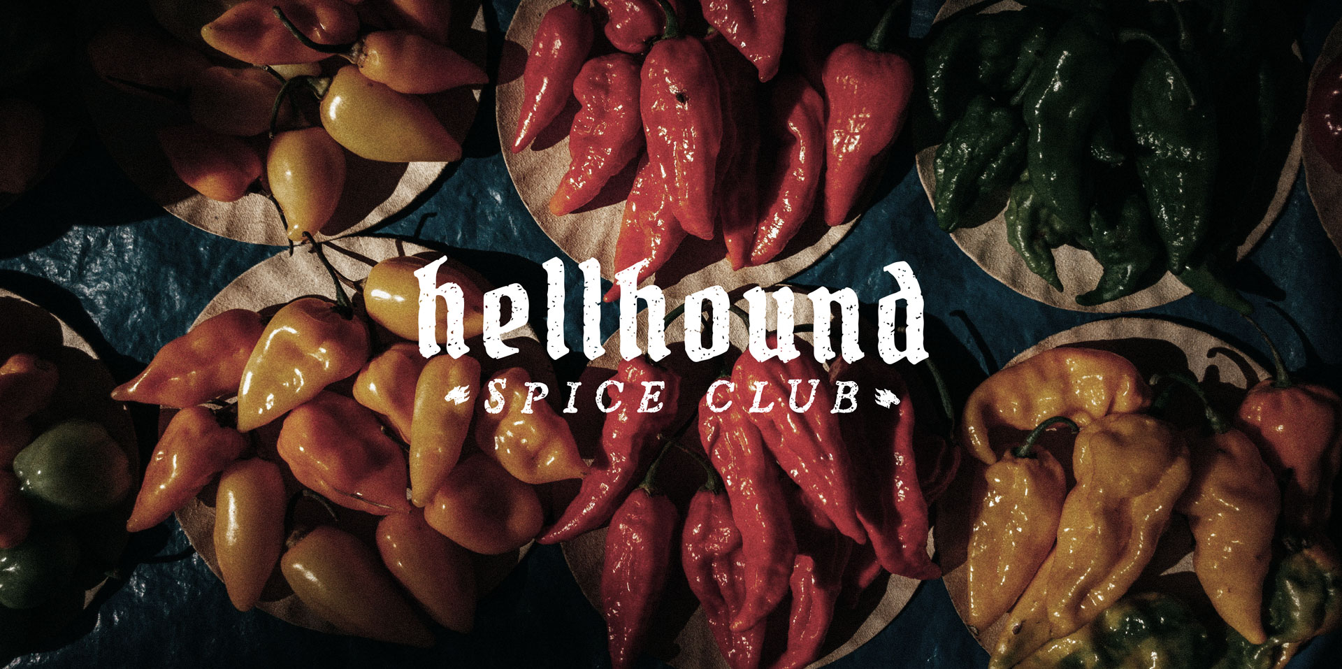 White Hellhound Spice Club logo over images of chile peppers