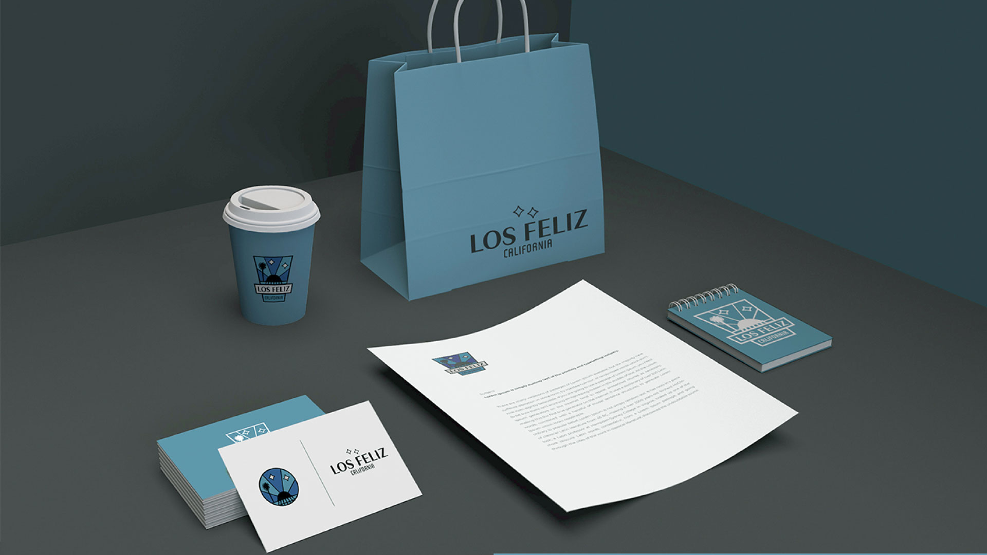 brand elements on stationary set, coffee cup, and shopping bag