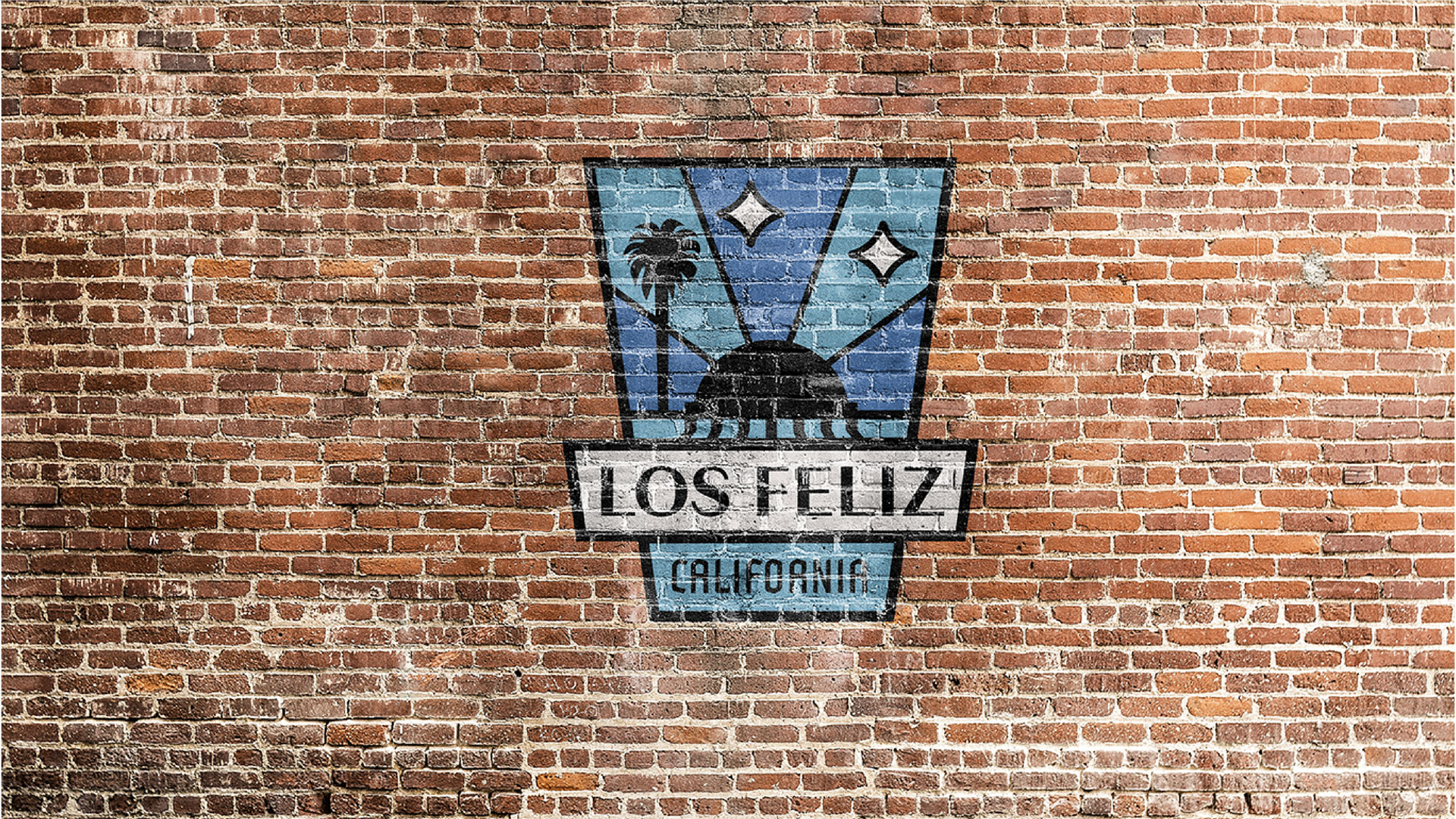 logo painted on brick wall